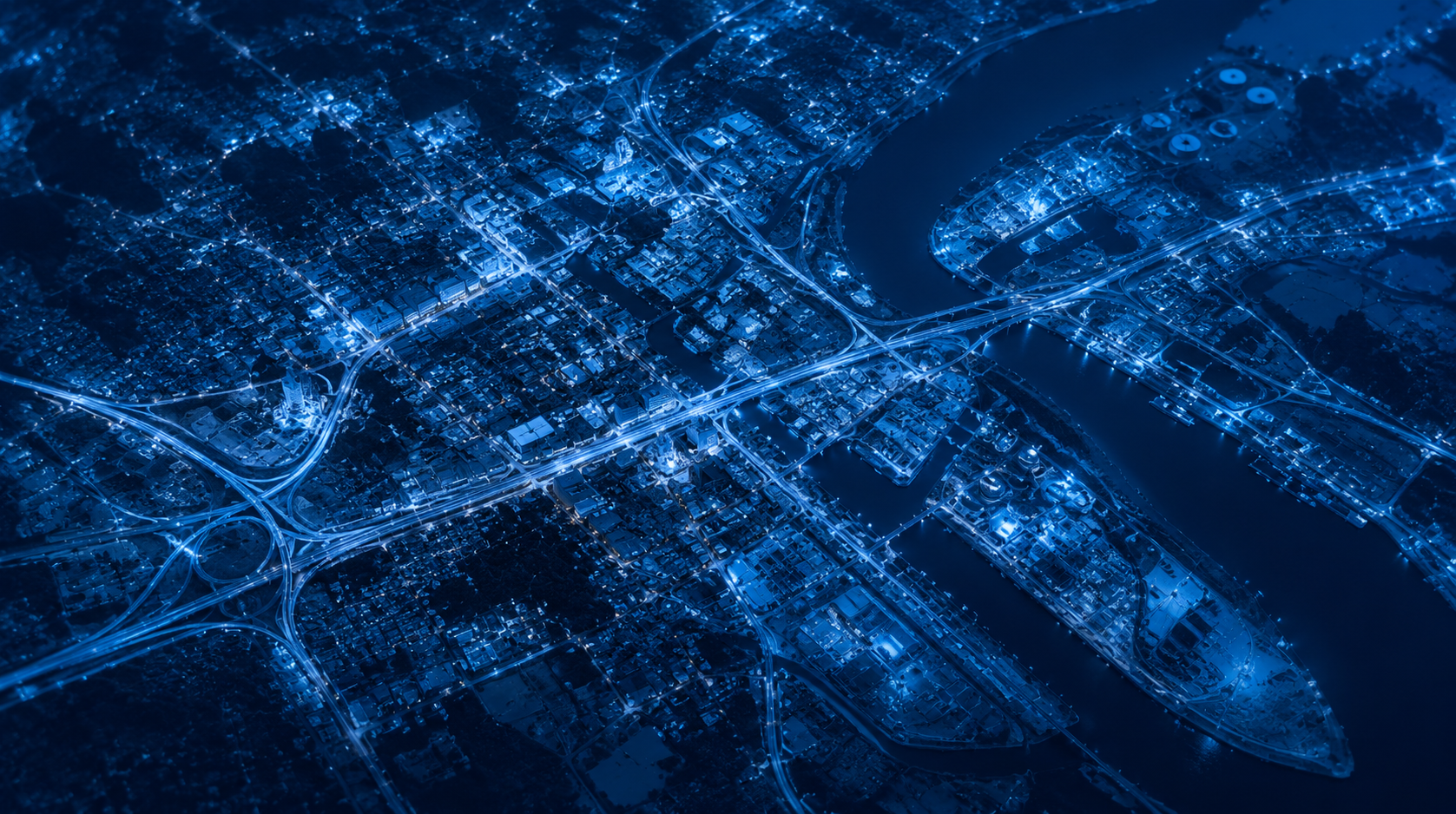 Project AZURE - Aerial night view of a city illuminated in blue